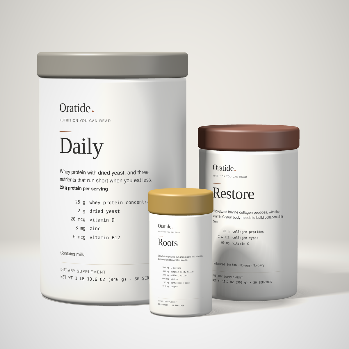 The Oratide 3-pack: the Daily canister, the Restore tub and the Roots capsule bottle together at true relative size, on a plain cream background.