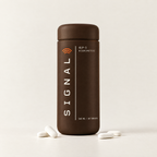 Oratide Signal: a matte espresso-brown bottle with SIGNAL printed vertically. 60 tablets, 560 mg yeast peptide per serving.